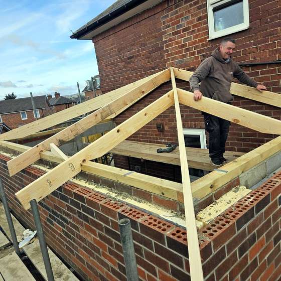 Bare roof timbers on the new extension