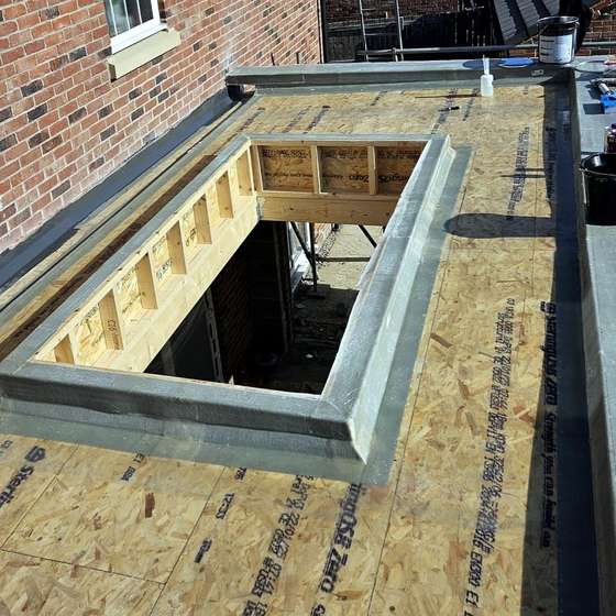 Boarded flat roof before the GRP finish in Adel