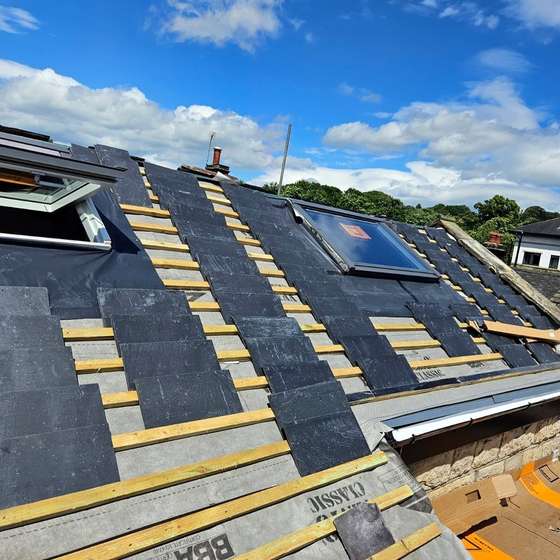 New slate going on over the battens