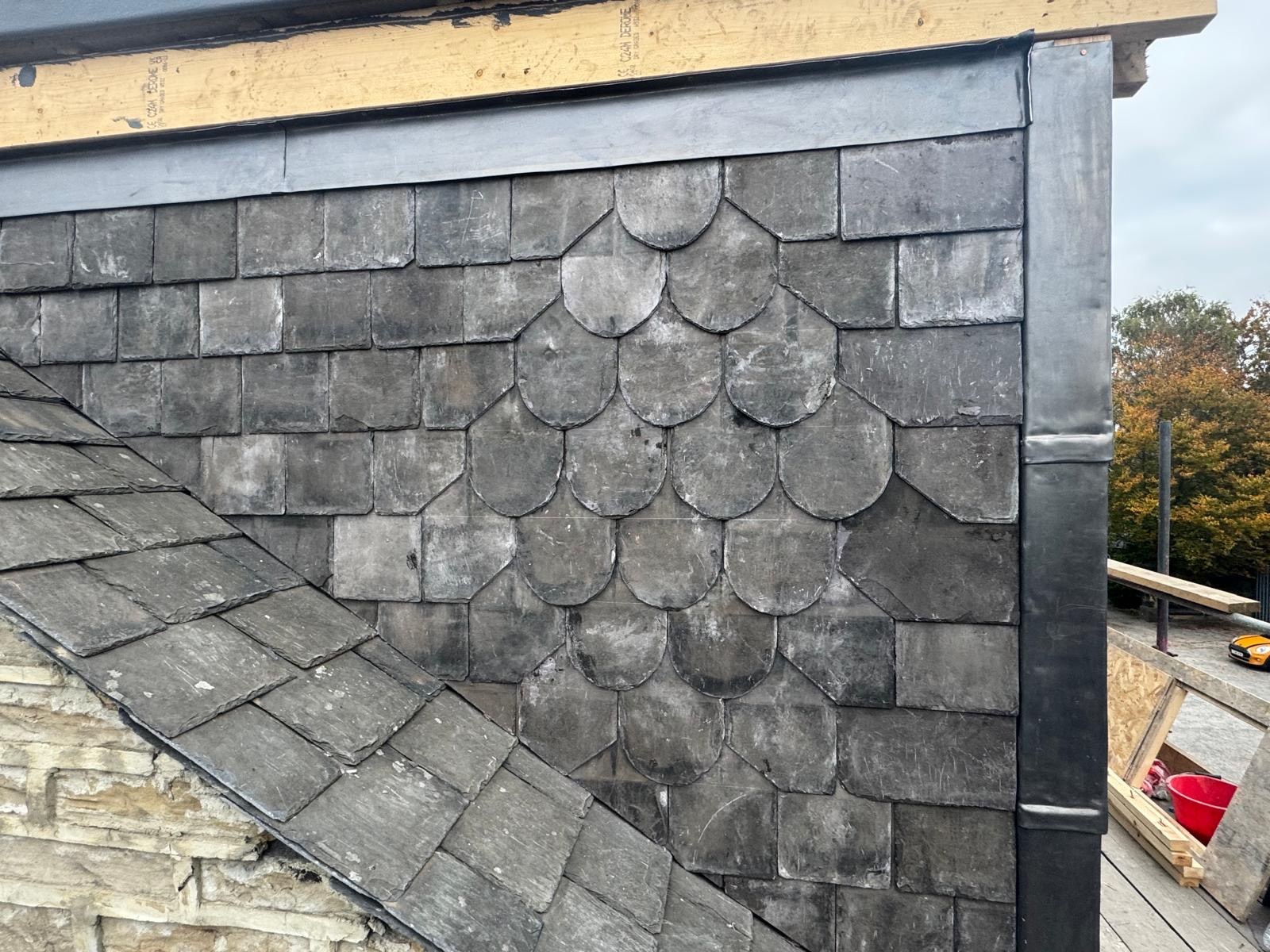 Decorative shaped slates within the dormer cheek cladding