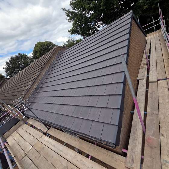 Tiles going on at the verge